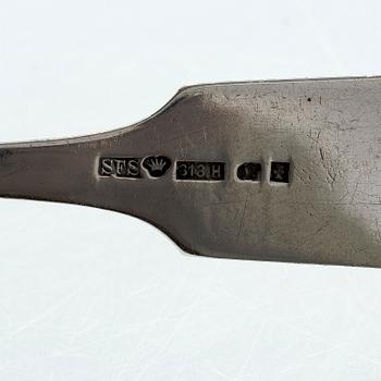 A pair of Russian silver salt cellars, a sprinkle spoon, a sauce ladle, and a tea strainer, Finnish marks.
