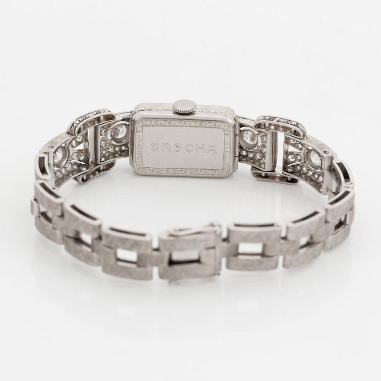 A bracelet/watch in platinum and 18K white gold set with old- and eight-cut diamonds.