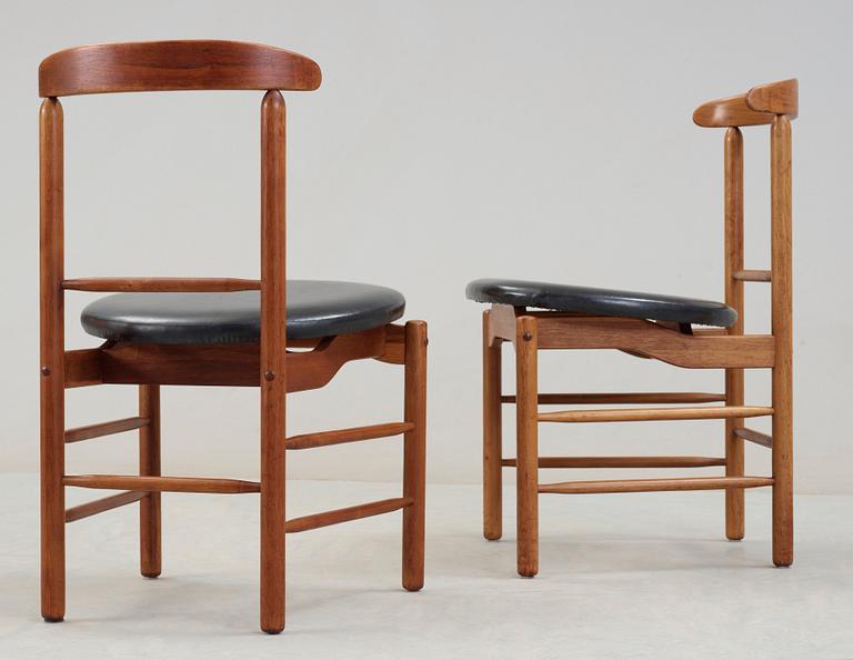 A pair of Greta Magnusson Grossman walnut and artificial leather chairs, for Glenn of California, USA 1950's.