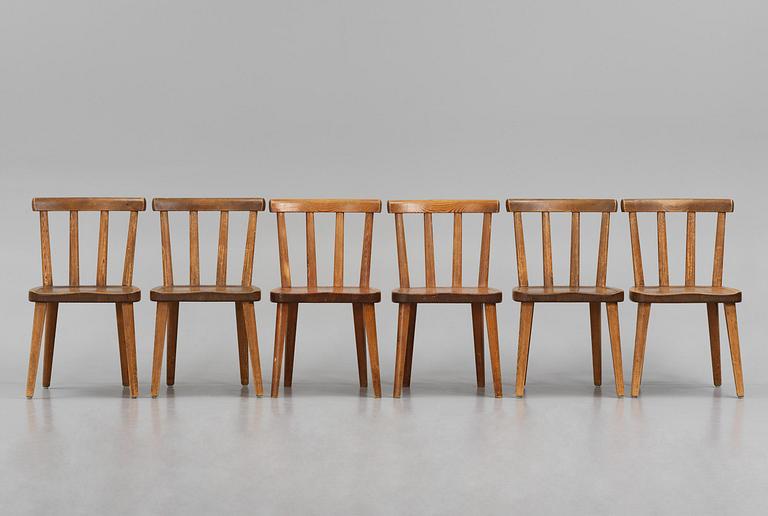 Axel Einar Hjorth, a set of six stained pine "Utö" chairs, Nordiska Kompaniet, Sweden, 1930s.