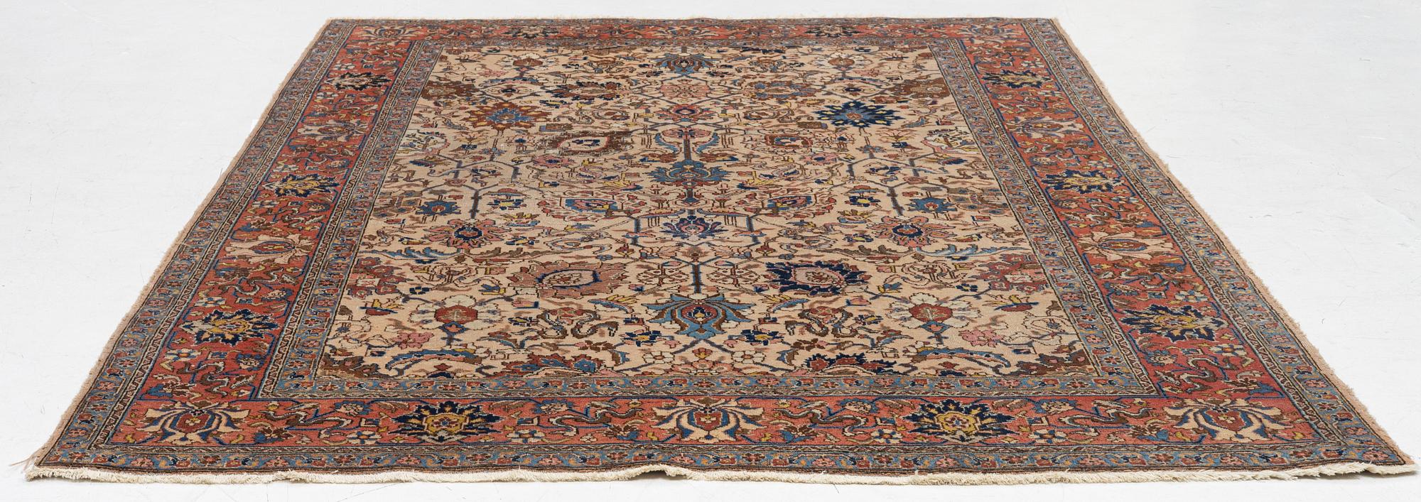 A semi antique Tabriz carpet, c. 290 x 195 cm.