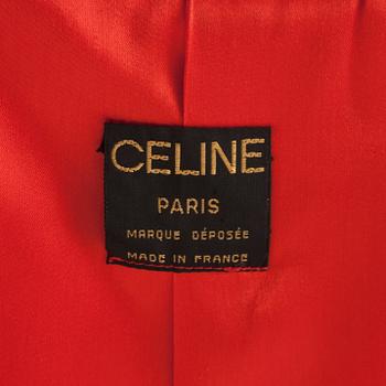 CÉLINE, a red cashmere and wool coat.