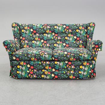 A sofa and wingback chair, later part of the 20th Century.