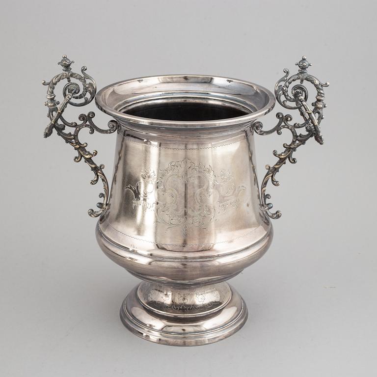 A silver plated winecooler.