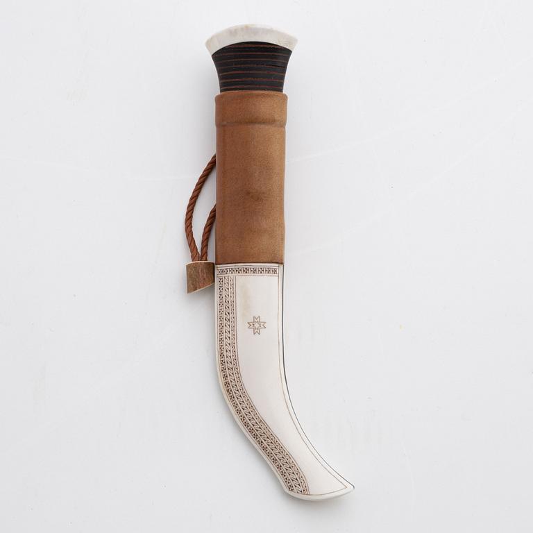 A reindeer horn and skin knife by Bertil Fällman, signed.