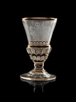 837. A cut, engraved and gilded armorial goblet, 18th Century.