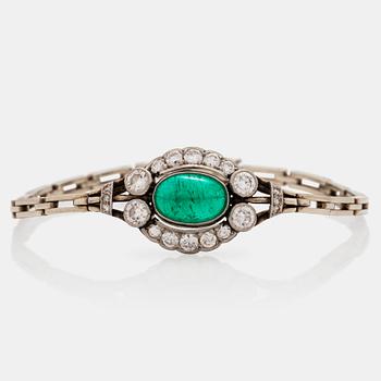 694. A cabochon cut emerald and brilliant cut diamond bracelet. Total carat weight of diamonds circa 1.10 cts.