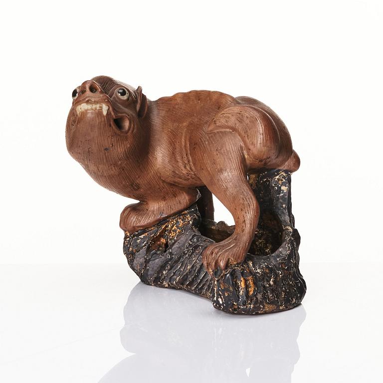 A pottery figure of a mythical beast, Qing dynasty (1644-1912).