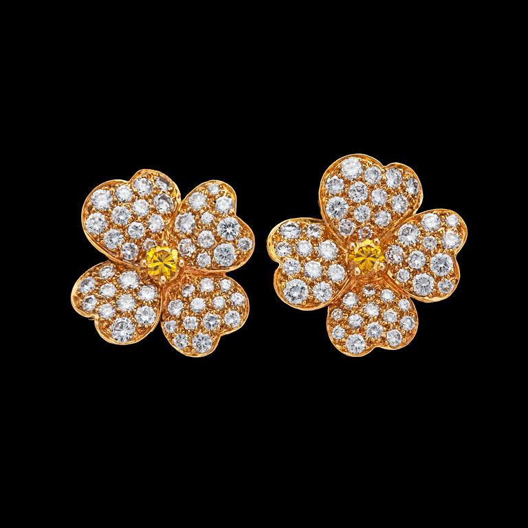 A pair of Van Cleef & Arpels 'Cosmos' brilliant cut white and fancy yellow diamond earrings, tot. 3.50 cts, Geneva 1985.