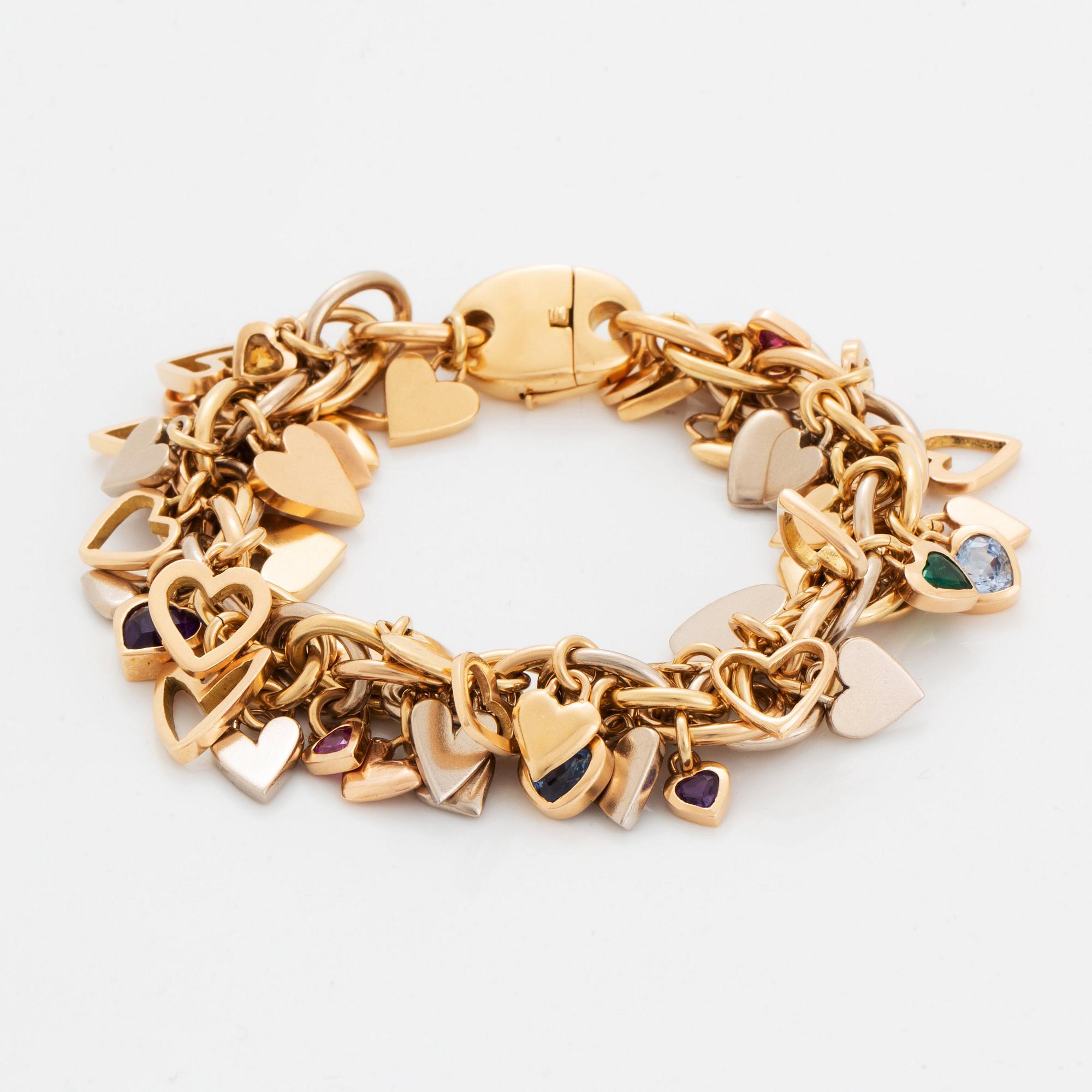 An 18K gold Gaudy bracelet with heart shaped charms.
