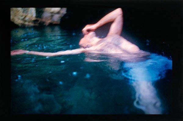 Nan Goldin, "The Devil's Playground" and "Guido floating, Levanzo, Sicily, 1999".