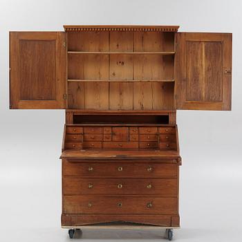 An oak writing cabinet, around 1800.
