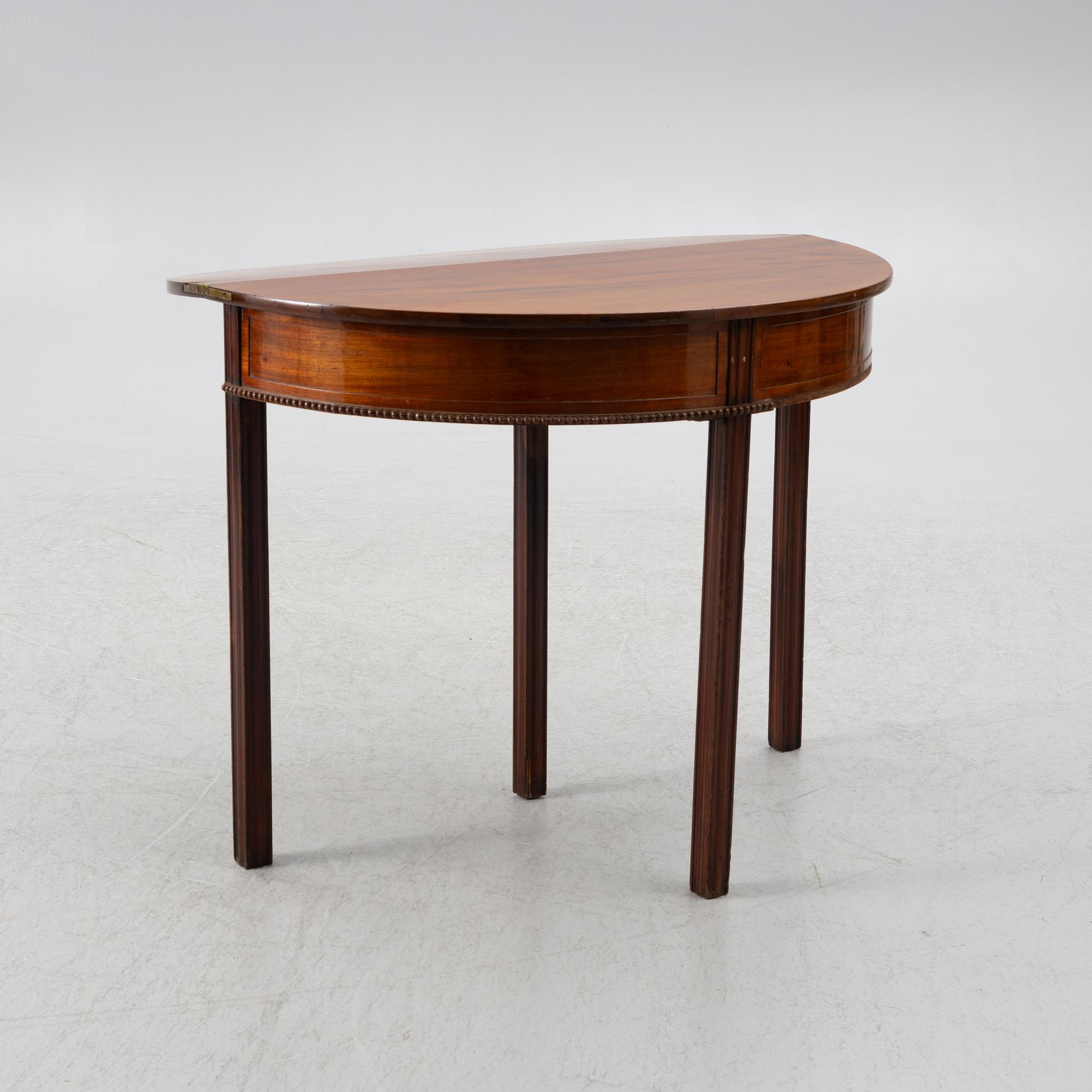 A late Gustavian mahogany games table by J. F. Wejssenburg (master in stockholm 1795-1837).