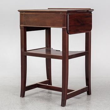 a mahogany writing desk from the second half of the 20th century.