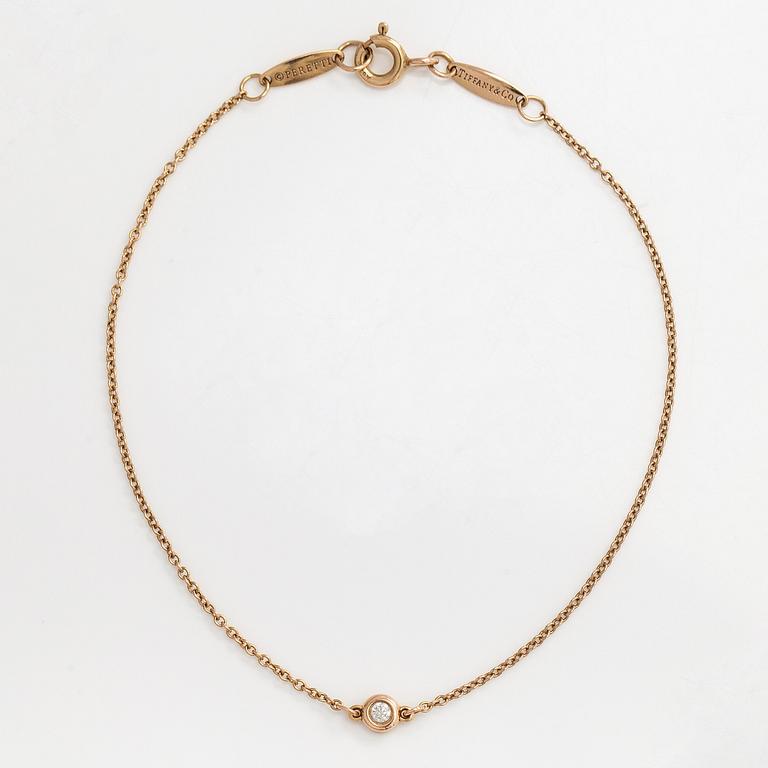 Tiffany & Co, an 18K gold 'Diamonds by the Yard' bracelet with a brilliant-cut diamond.