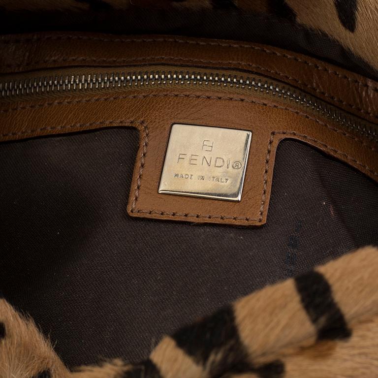 FENDI, a pony hair handbag.