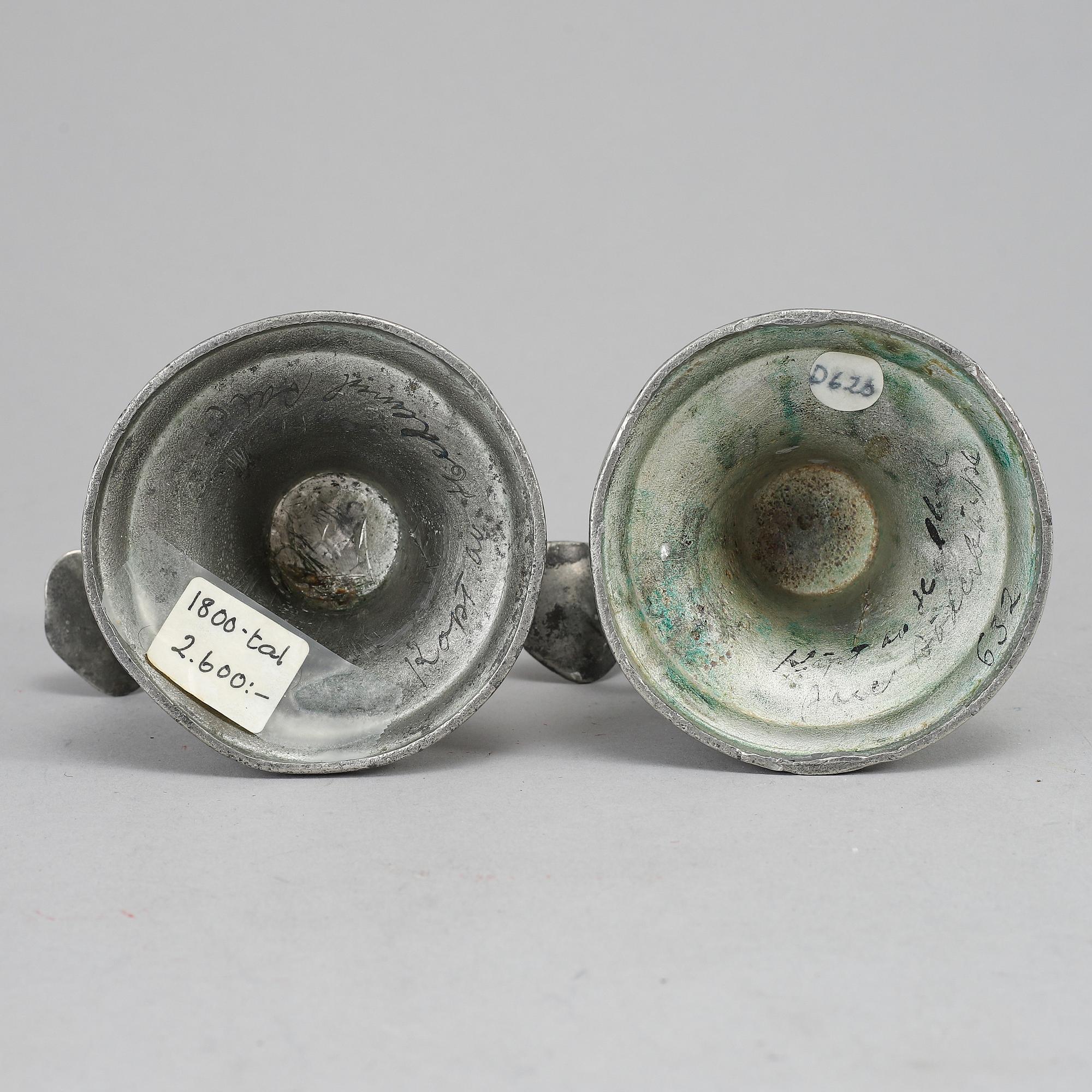 A pair of 19th century pewter candlesticks.