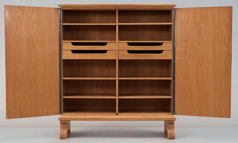 An Otto Schulz oak cabinet, for Boet, Gothenburg 1944, the sides and doors covered in artificial leather.