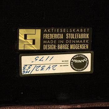 A two-seat leather sofa by Børge Mogensen for Fredrika Stolefabrik, Denmark.