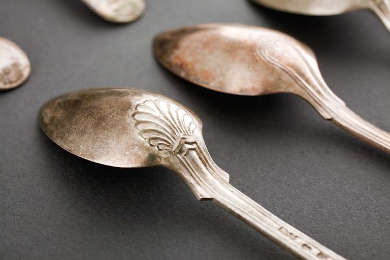 A silver set of table ware, 27 pcs, 19th and 20th century.