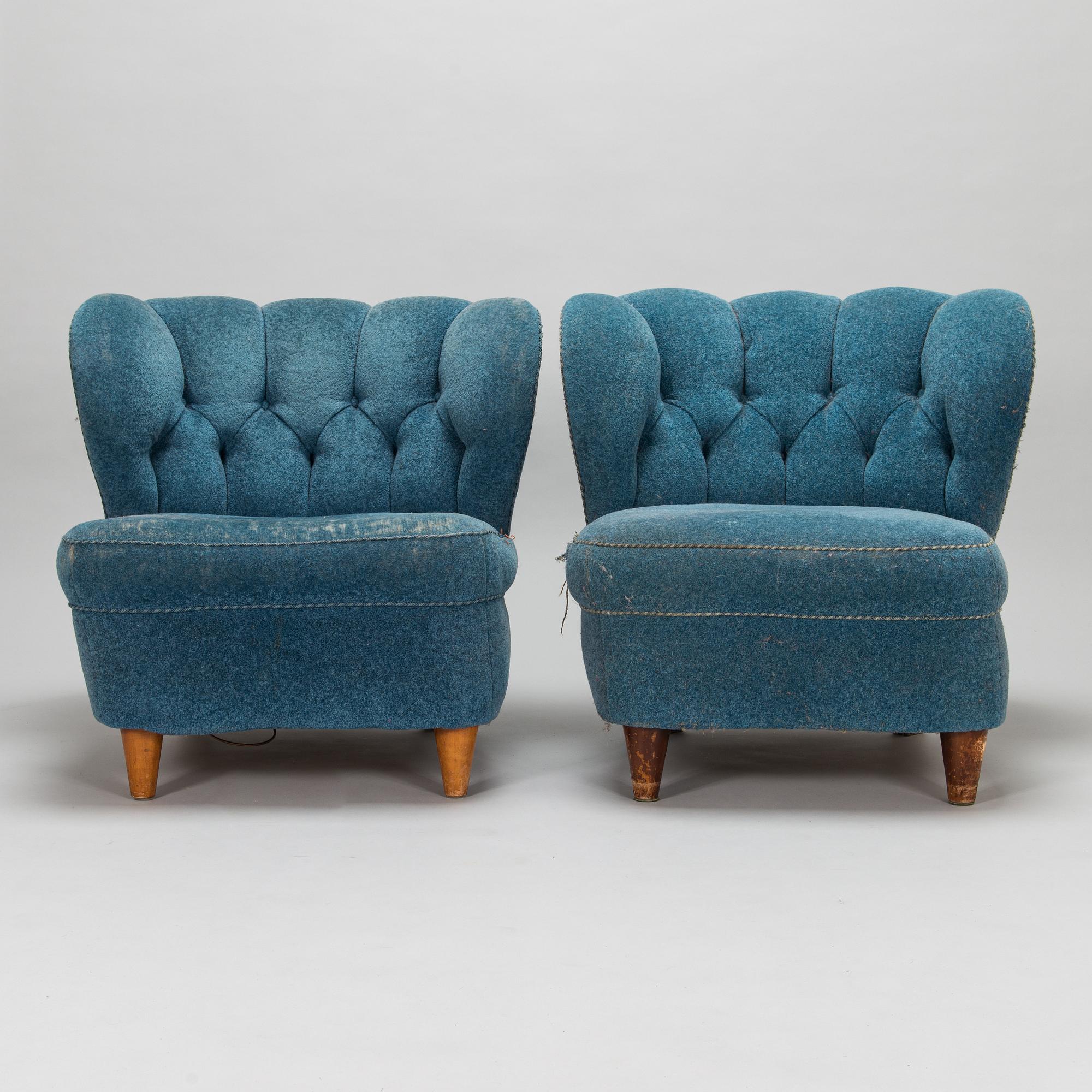 A pair of mid-20th-century armchairs.