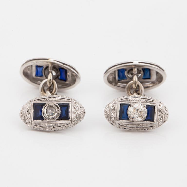 A pair of diamond and most likely synthetic sapphire cufflinks.