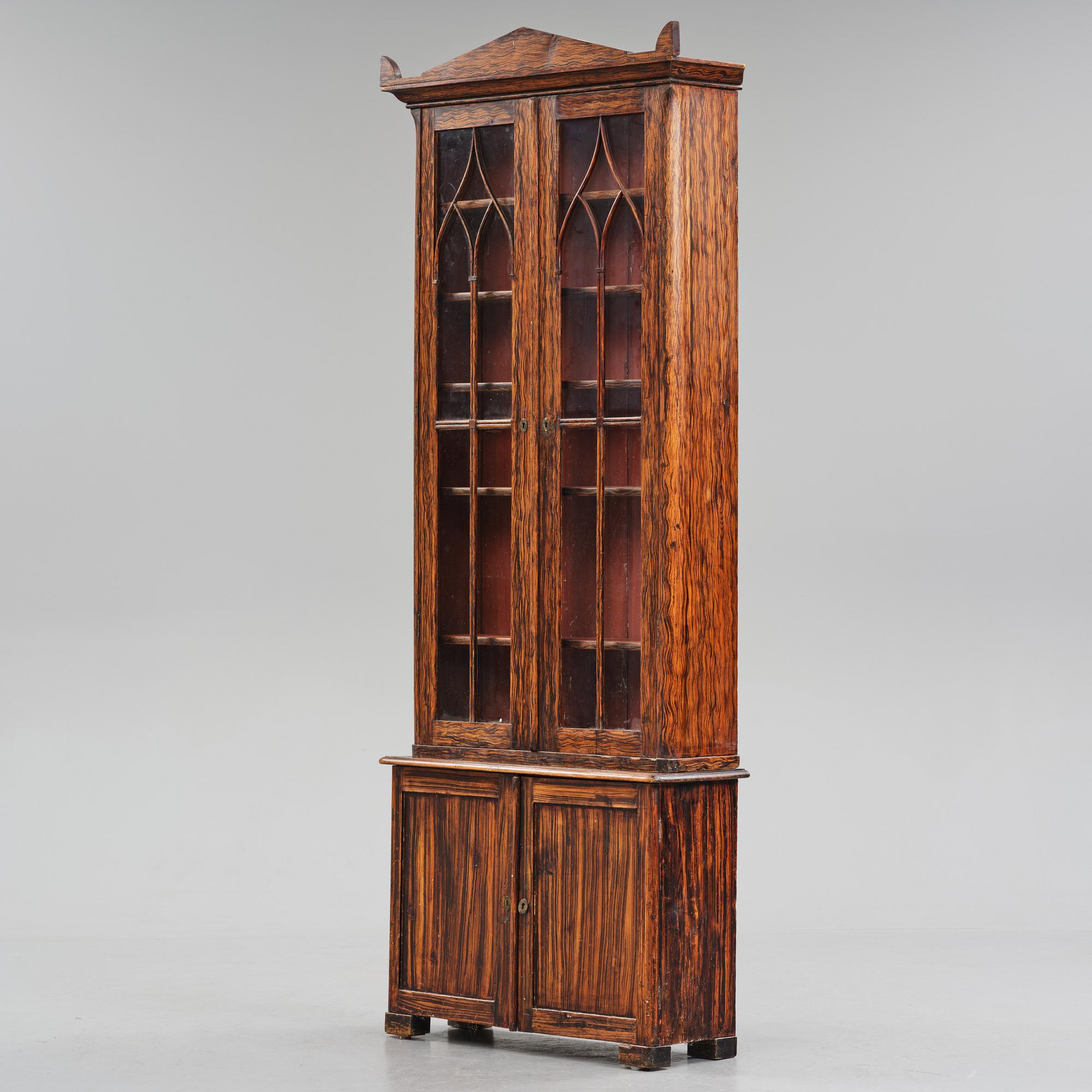 A Swedish faux-boix neo-gothic book cabinet, ca 1830.