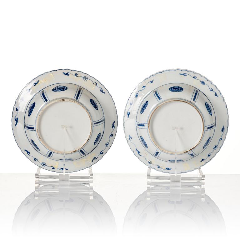 A pair of blue and white Kangxi style dishes, 19th Century.