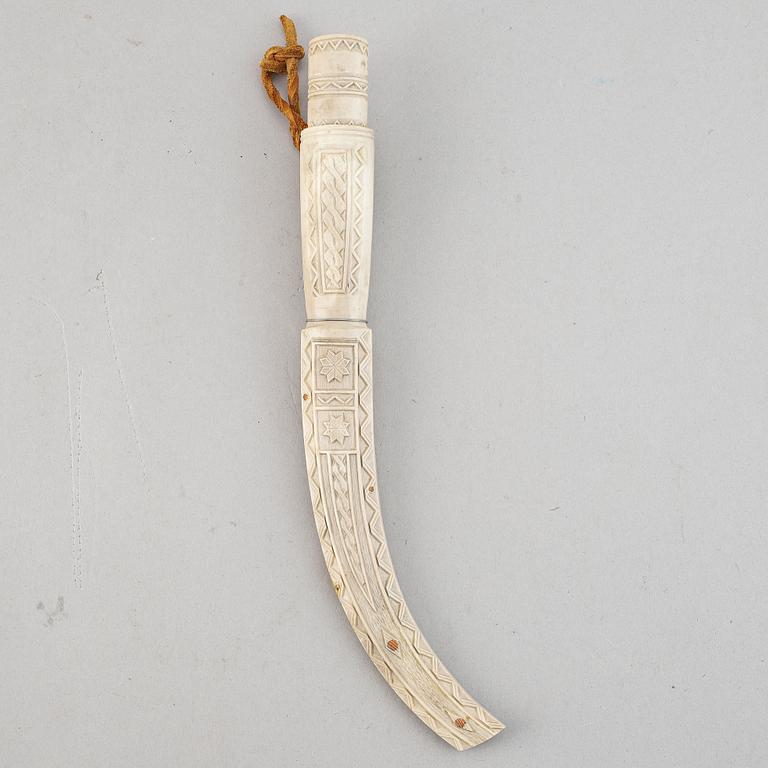 A reindeer horn Sami knife, signed SJ.