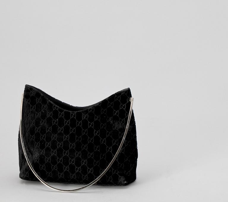 A black monogram suede handbag by Gucci, fall/winter 1997, The Tom Ford collection.