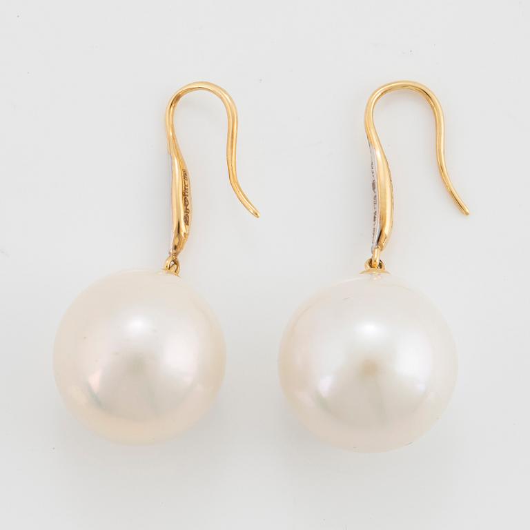 Cultured freshwater pearl and diamond earrings.