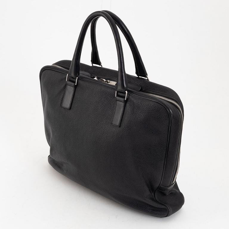 Christian Dior, a black leather briefcase.