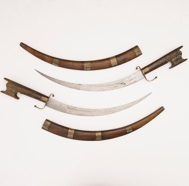 Pair of North African Nimcha short swords, first half of 20th Century.