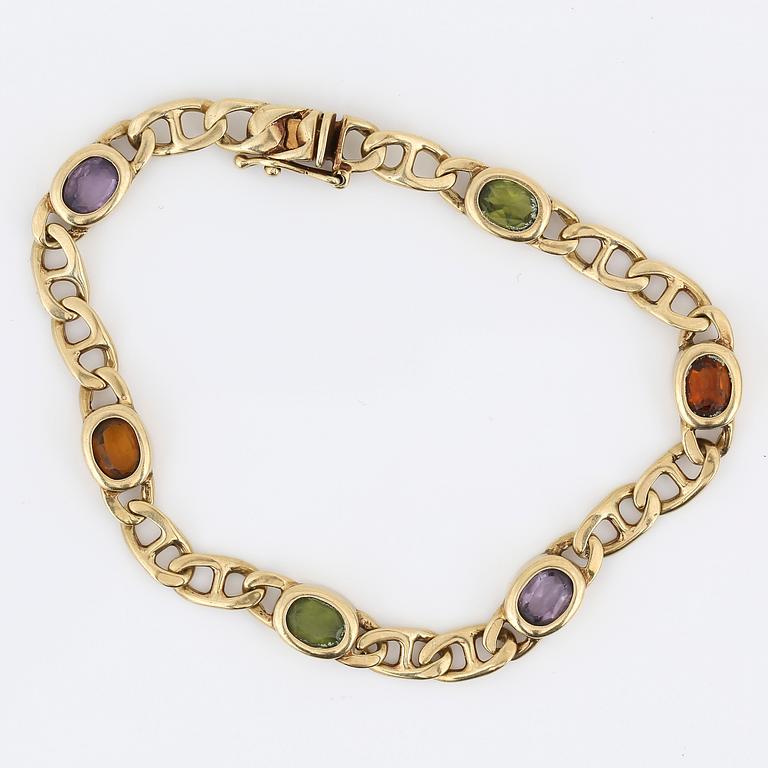 ARMBAND, 14K guld med olikfärgade stenar, sannolikt ametister, citriner och peridoter, Italien. Vikt 12,89 gram.