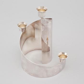 A candle holder in silver, unidentified designer, made by MEMA in linköping 1993. Weight 581 g.