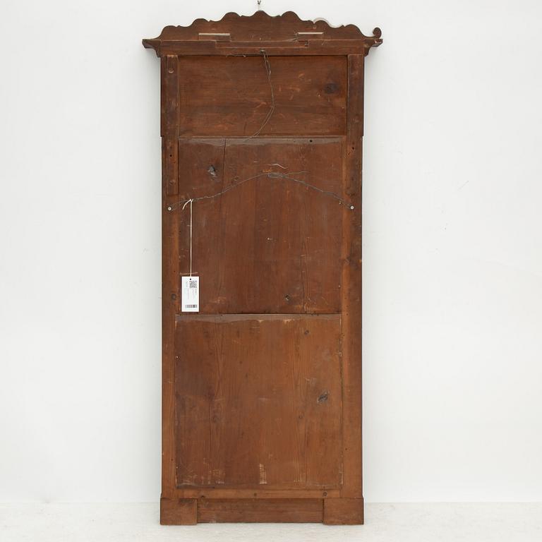 A Swedish Empire mirror with a console table, first half of the 19th Century.