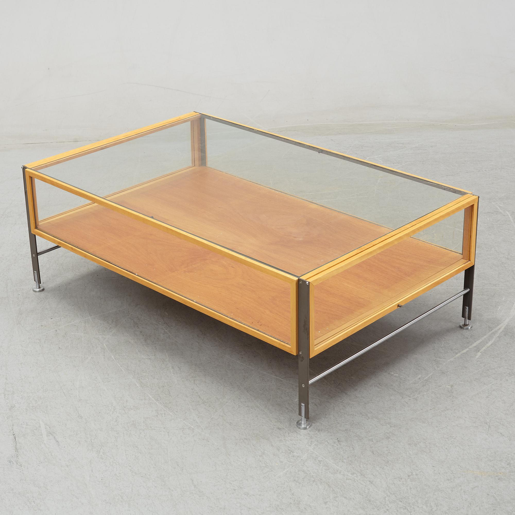 A glass top coffee table, late 20th Century.