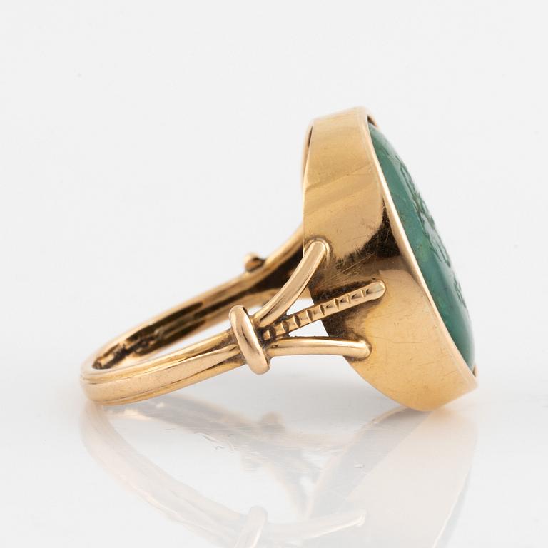 Green carved stone ring.