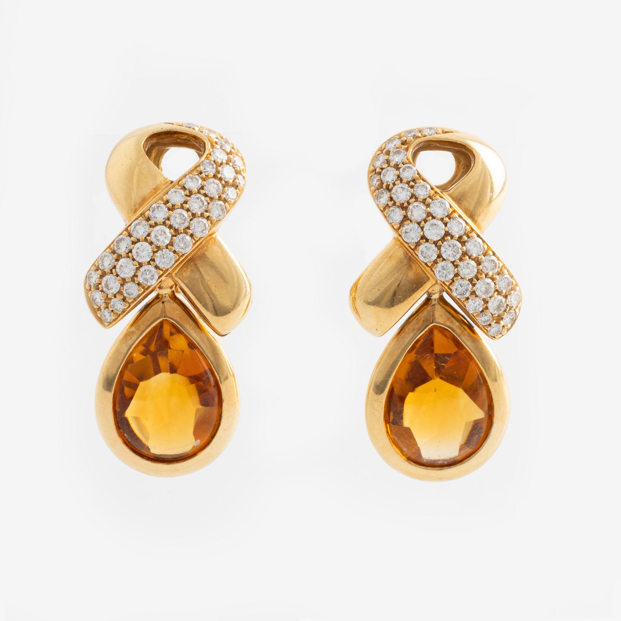 Earrings with pear-shaped citrines and brilliant-cut diamonds.