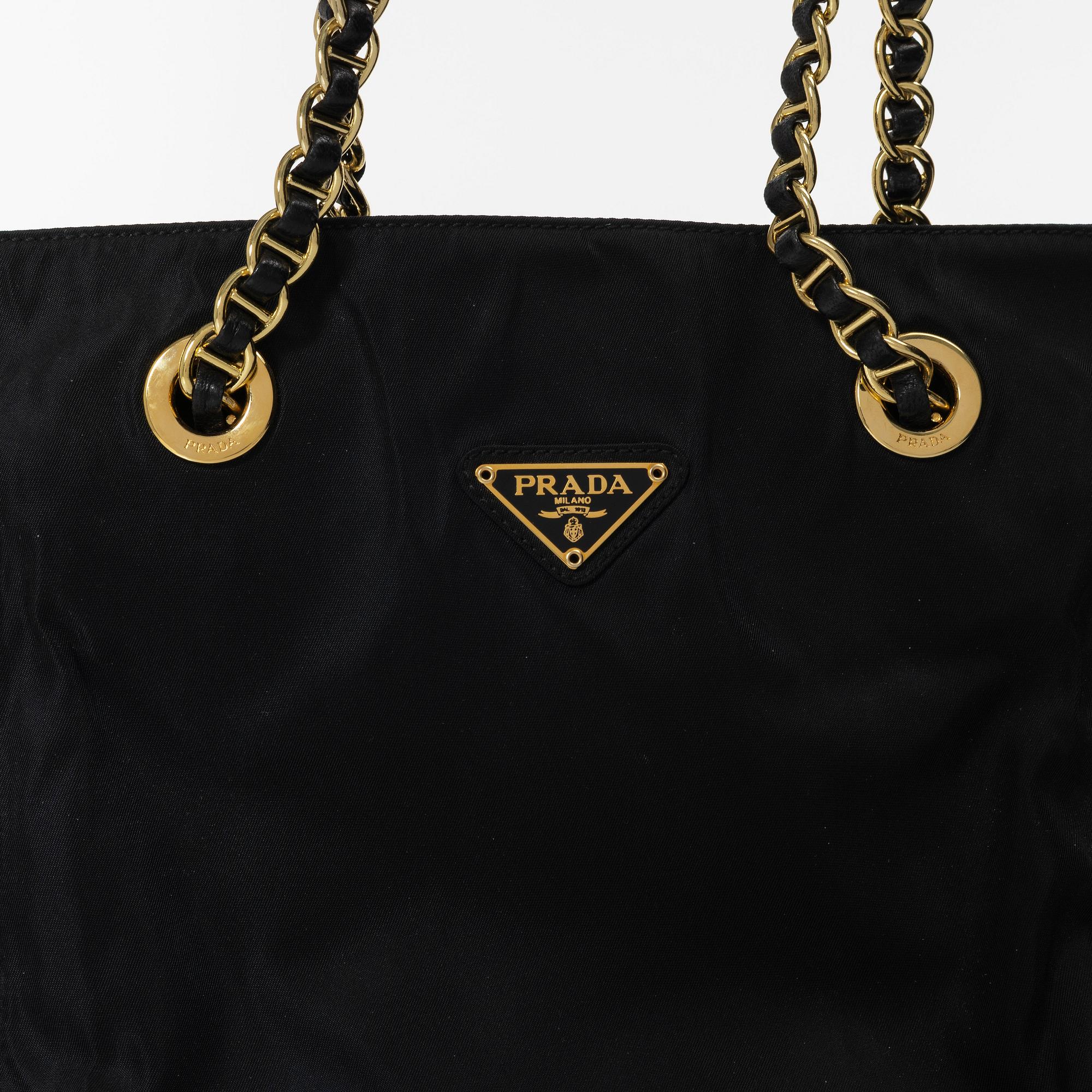 Prada, A black nylon bag.