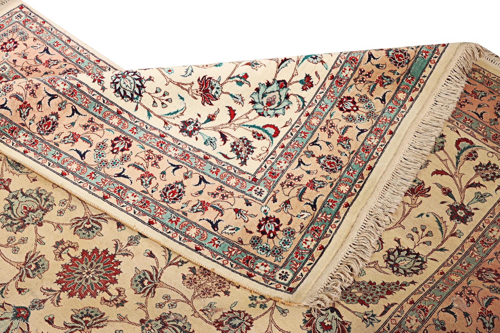 An oriental silk carpet, a. 280 x 185 cm.