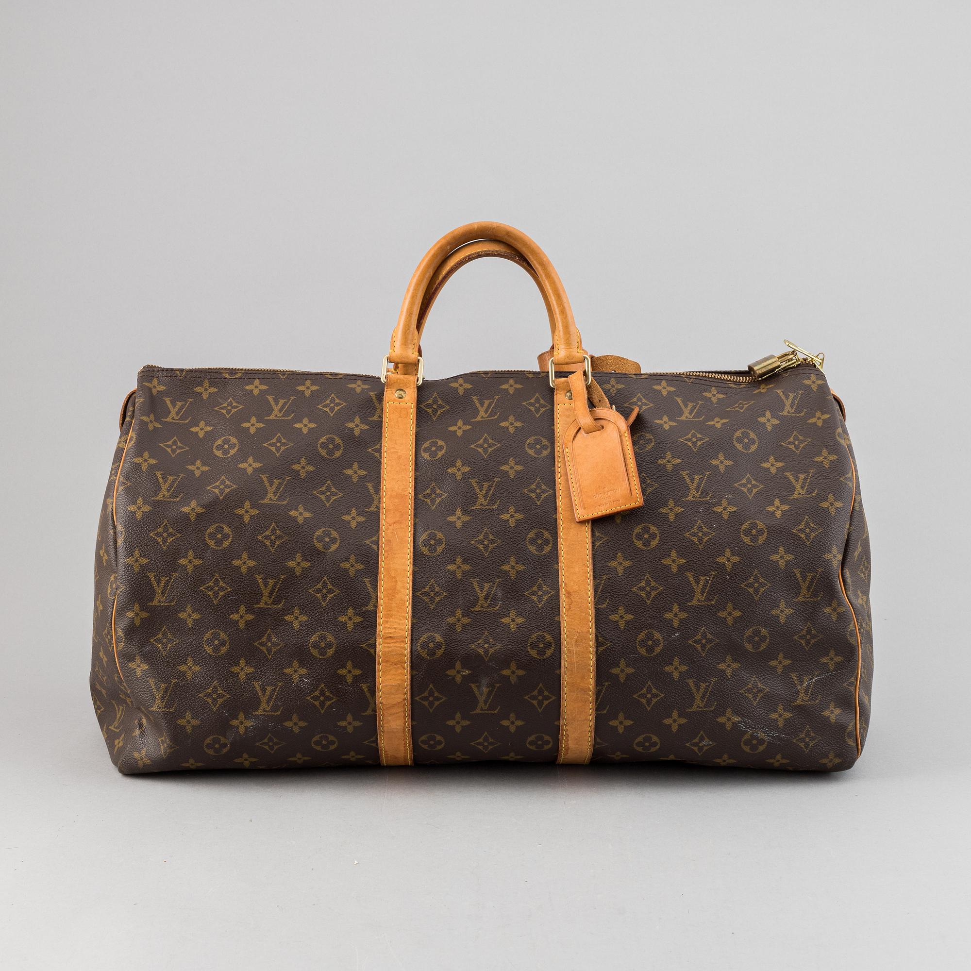 Louis Vuitton, a monogram canvas 'Keepall 55' weekend bag and toilet bag.