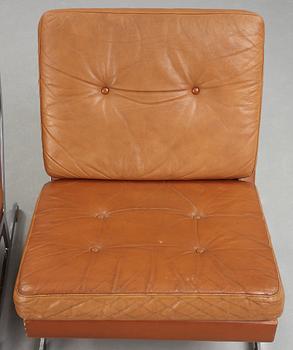 A pair of Poul Nørreklit chromed steel and brown leather easy chairs, Selectform, Denmark 1960's.