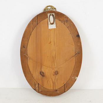 A mahogany veneered mirror sconce, Empire style, around 1900.