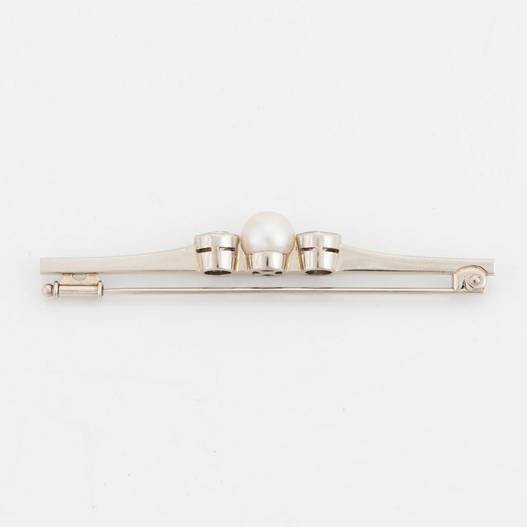 A 14K white gold brooch set with old-cut diamonds and a cultured pearl.