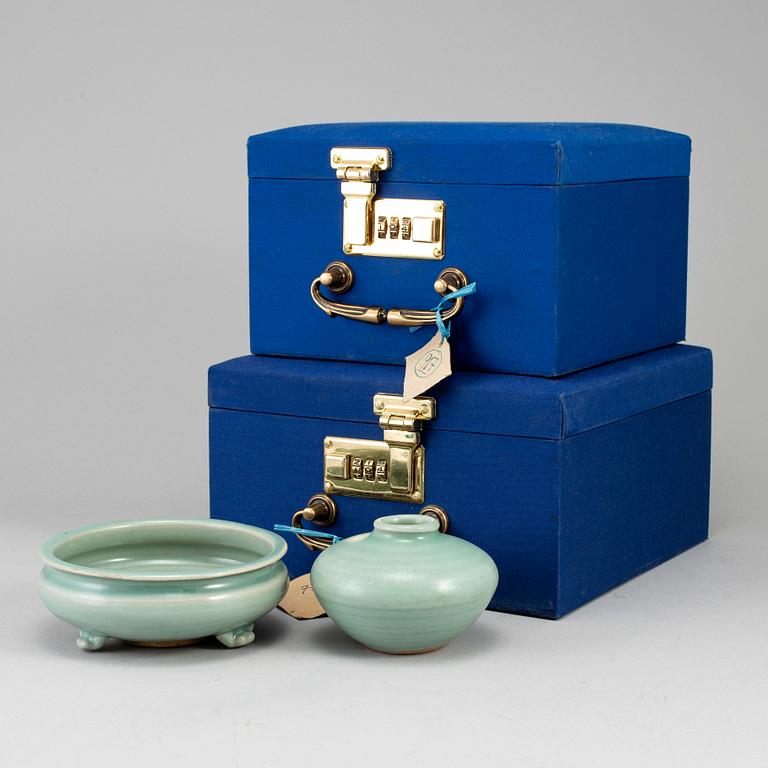 A celadon glazed tripod censer and a vase, Ming dynasty (1368-1644).