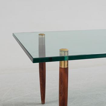 A 1960's glass sofa table.