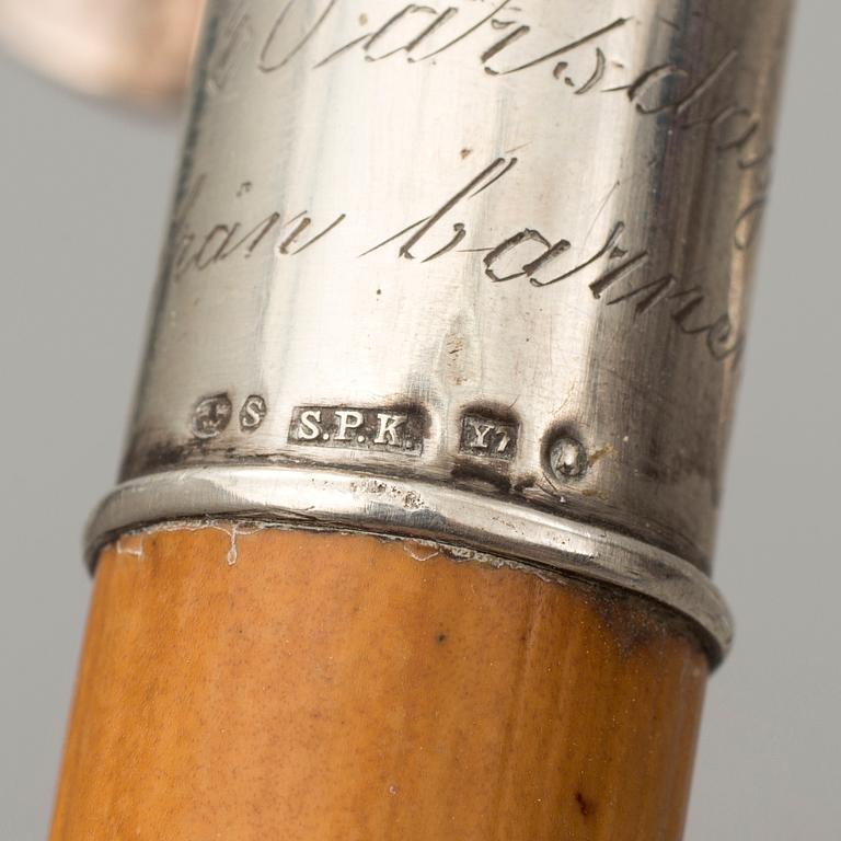 NINE WALKING STICKS, silver handles and a stick with plate handle, first half of the 20th century.