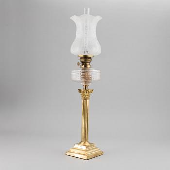 A brass oil lamp, ca 1900.