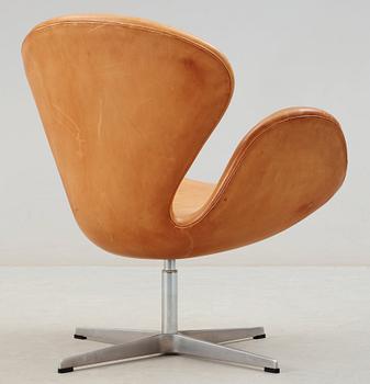 An Arne Jacobsen leather 'Swan' chair, Fritz Hansen, Denmark 1993.